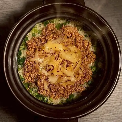Keema curry rice cooked in an earthenware pot.