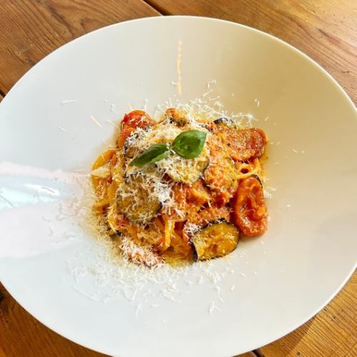 Amatriciana with eggplant and sausage ~ topped with pecorino cheese ~