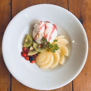 Colorful seasonal fruits and burrata cheese