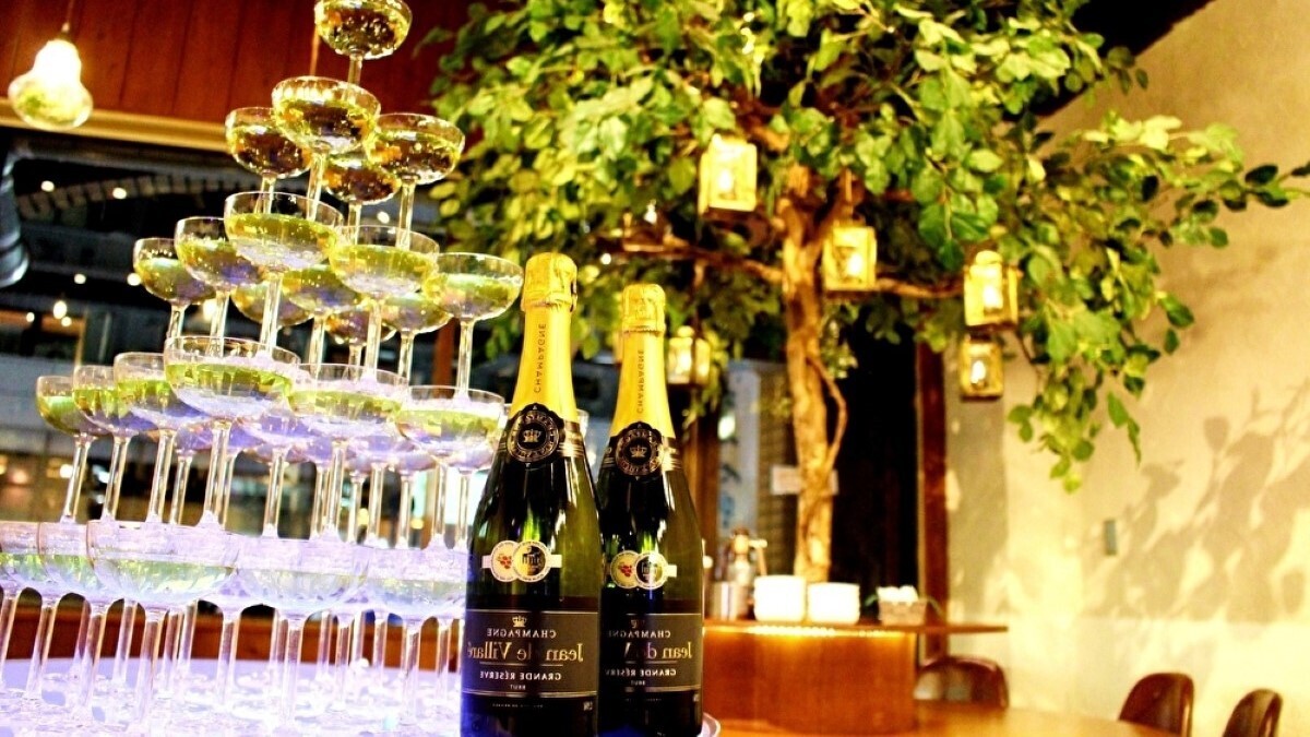 A luxurious toast with a champagne tower! The lighting creates a great atmosphere