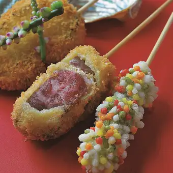 A 16-course omakase (chef's choice) menu featuring a comparison of A5-grade beef fillet and Kuroge Wagyu beef sirloin skewers, with a welcome drink included.