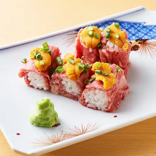 Seared fillet sushi topped with fresh sea urchin