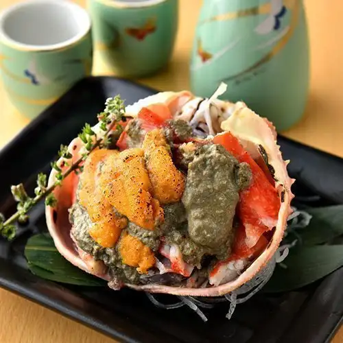 Grilled crab shell topped with sea urchin