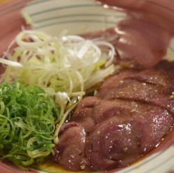 Fatty liver covered in green onions