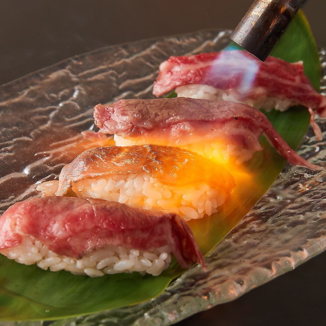 A selection of exquisite dishes such as ``Miyako Wagyu Grilled Nigiri'' made with Miyako beef