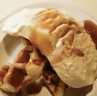 Waffles and ice cream with caramel sauce