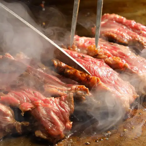 Each table is equipped with a griddle.