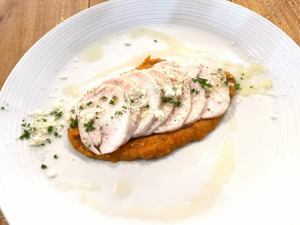 Homemade chicken ham with romesco sauce