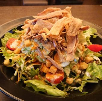 Caesar salad with frontal root vegetable chips