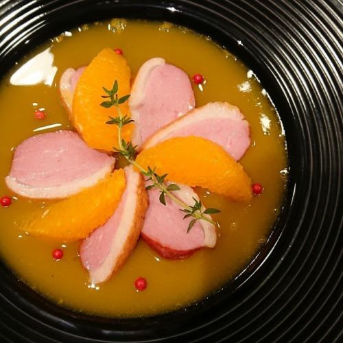 Black tea duck with smoked orange sauce