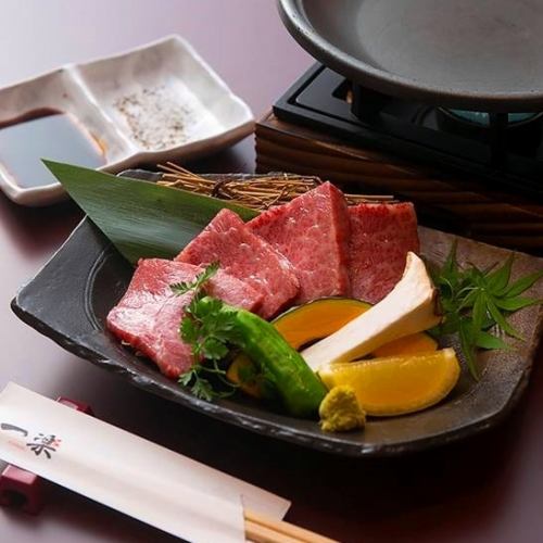Japanese black beef triangle rose and seasonal vegetables grilled on a ceramic plate