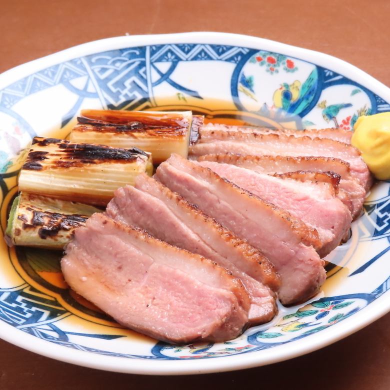 Charcoal-grilled duck and green onions