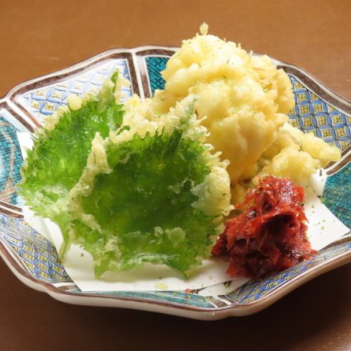 Pike conger tempura with pickled plum and bonito flakes.