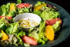 Salad with seasonal fruits and stracciatella