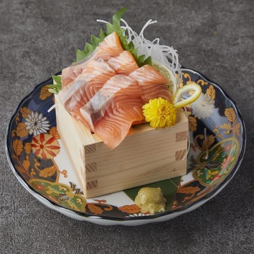Salmon sashimi in a wooden box