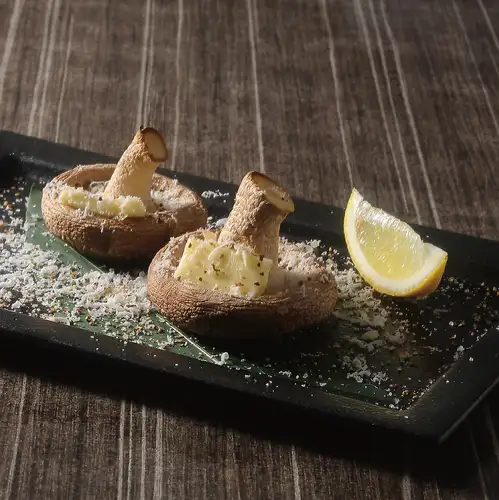 Grilled shiitake mushrooms from Hokkaido, topped with butter and Parmesan cheese.