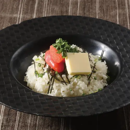 Tarako butter rice, served with shiso leaves, green onions, and roasted seaweed.