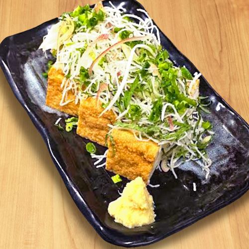 Thick fried tofu with plenty of condiments