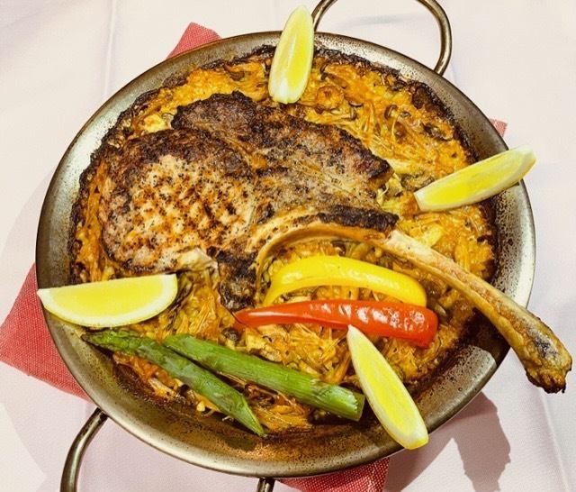 Tomahawk paella (grilled bone-in pork loin and mushroom paella) Serves 3 to 4 people
