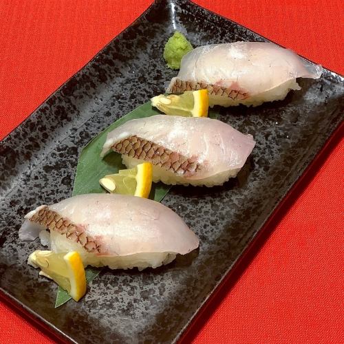 Grilled sea bream nigiri with salted lemon