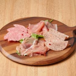 Assortment of raw ham and salami