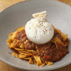 Domestic raw burrata and bolognese pasta