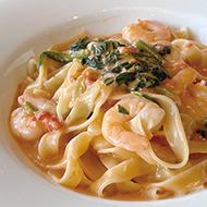 Tomato cream with shrimp and spinach