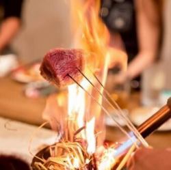 Fresh seasonal fish grilled over straw