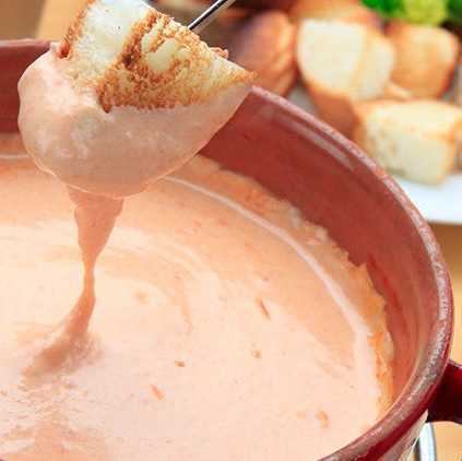 Tomato cheese fondue with bread and vegetables!