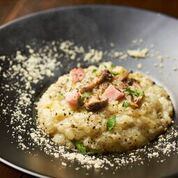 Basil cream risotto with bacon and mushrooms