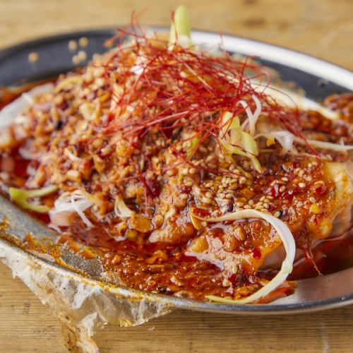 Gyoza dumplings with chili oil and green onions