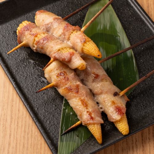 2 skewers of young corn