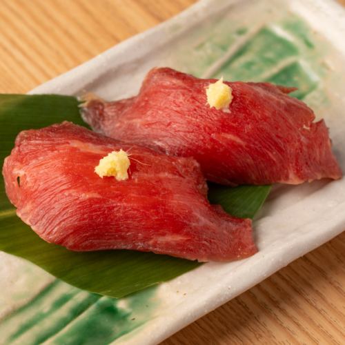 2 pieces of marbled horse meat sushi