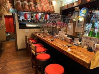 Singles are also very welcome! Counter seats lined with awamori bottles