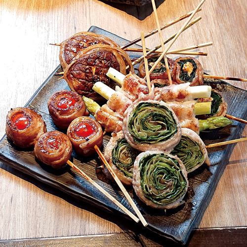 A variety of skewers including specialty meat rolls
