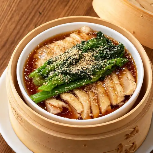 Steamed chicken and rapeseed blossoms in a Chinese-style sauce.