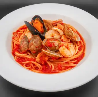 Assorted seafood in tomato sauce (shrimp, scallops, squid, clams, mussels)