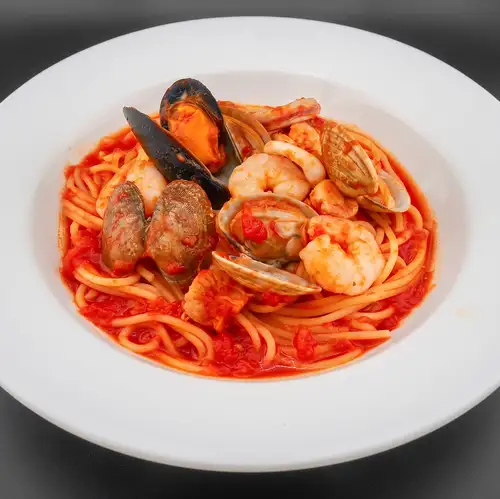 Assorted seafood in tomato sauce (shrimp, scallops, squid, clams, mussels)