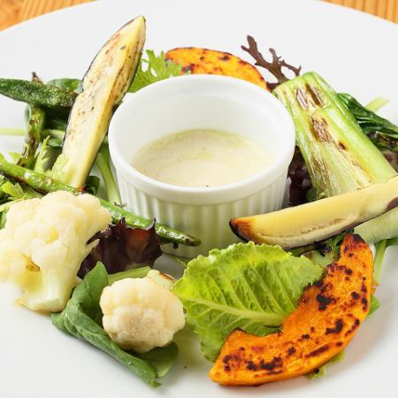 Grilled vegetables and salad while dipping in tofu dressing