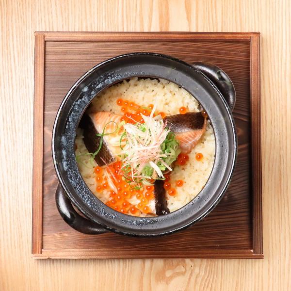 Salmon and salmon roe rice in clay pot