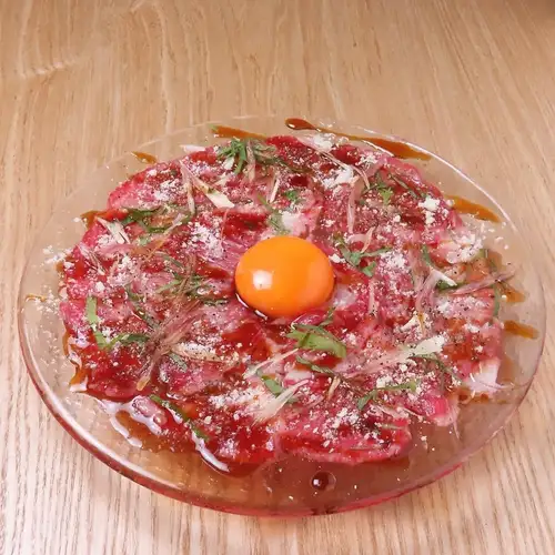 Seared Sendai beef tataki with egg yolk and Parmesan cheese