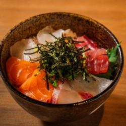 Bowl of rice topped with sashimi