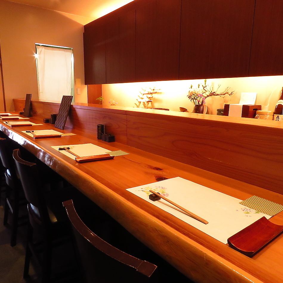 The restaurant has a warm wooden atmosphere and is equipped with private rooms with sunken kotatsu tables.