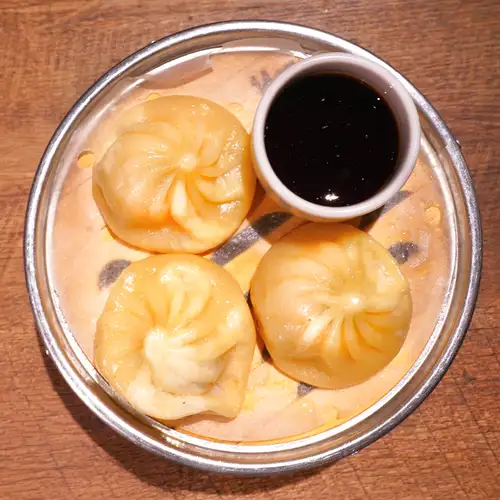 Xiaolongbao eaten with mustard soy sauce