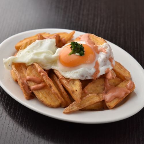 Spanish fries with soft-boiled egg