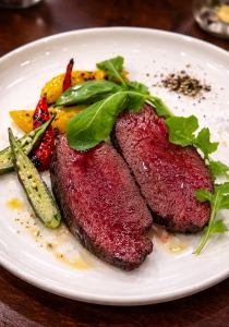 Grilled venison over charcoal