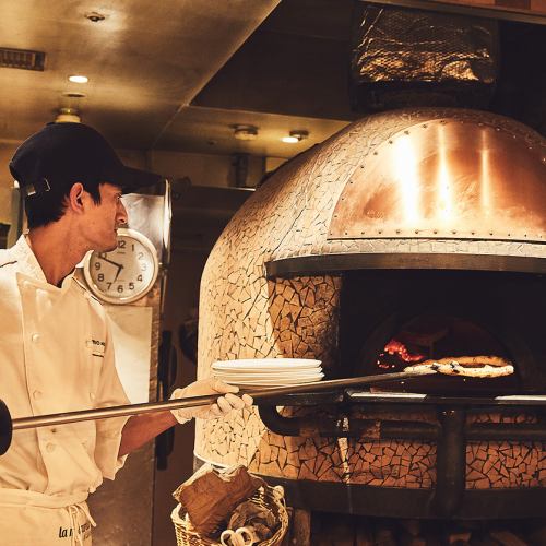 Authentic pizza made in a wood-fired oven