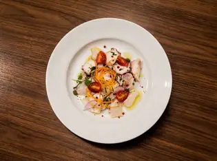 A refreshing appetizer from the sea: Marinated octopus and tomatoes.