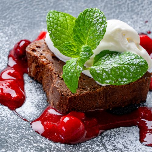 Homemade chocolate cake with berry sauce
