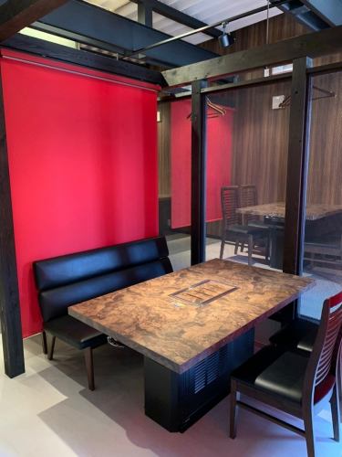 The seats are semi-private and separated by roller curtains.